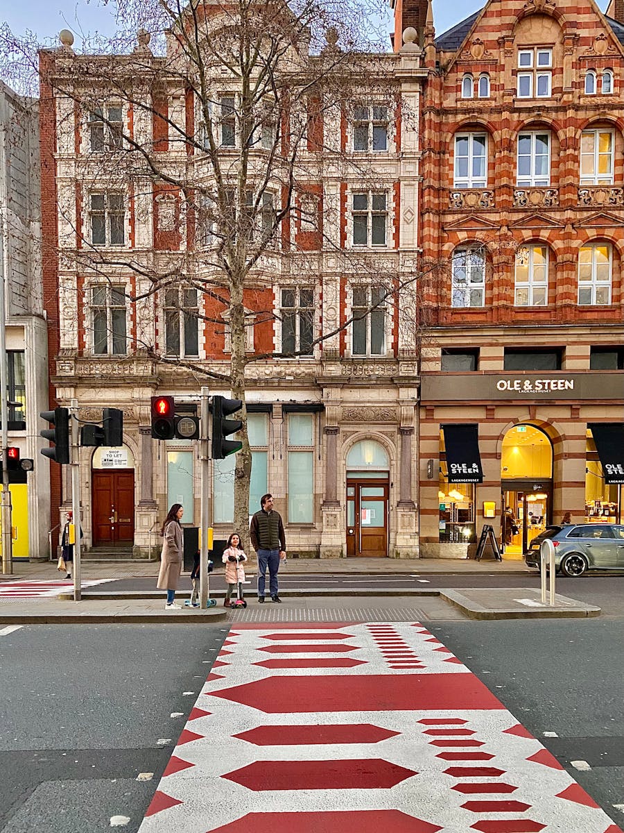 Family Waiting on Zebra Crossing - family trip to London top neighbordhoods