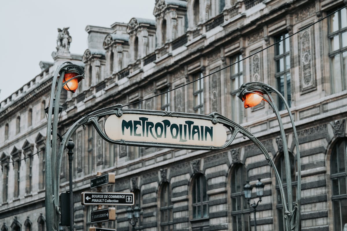 Art Nouveau Sign Above the Entrance to the Pere Lachaise Metro Station in Paris - Paris budget travel guide