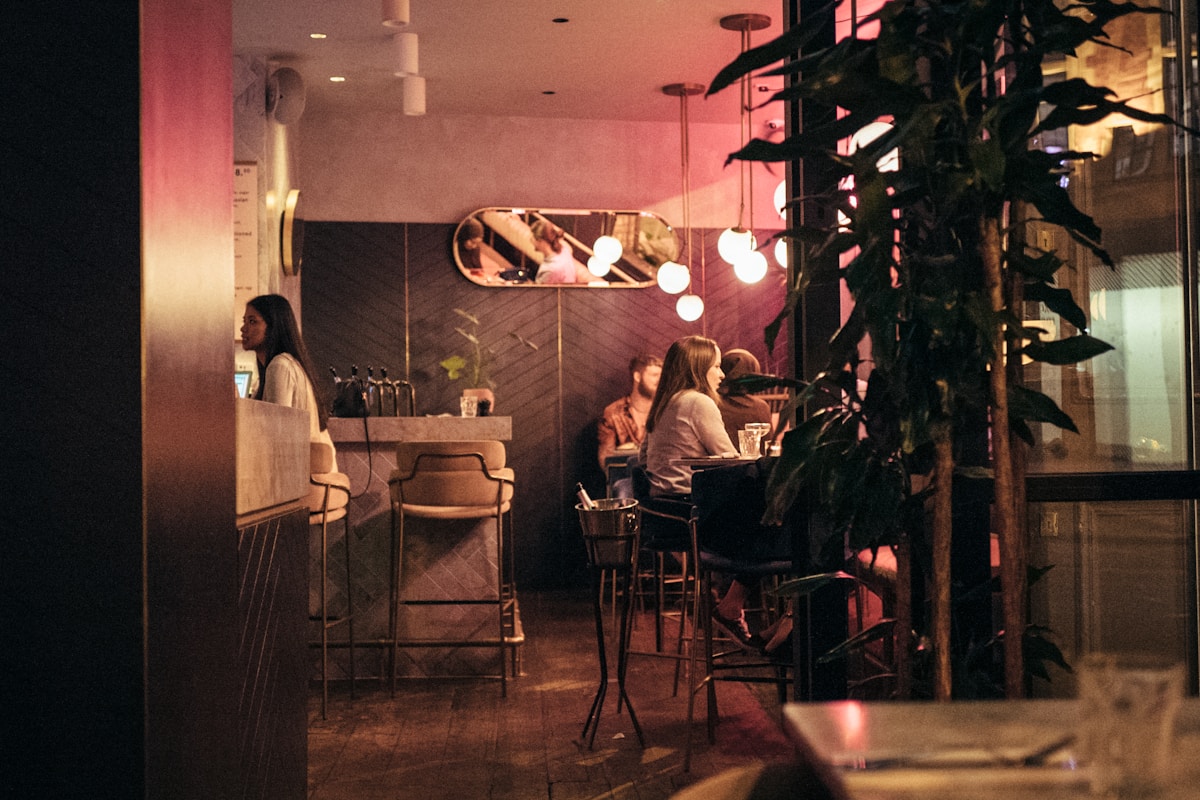 a group of people sitting at a table in a restaurant - visiting London for the first time