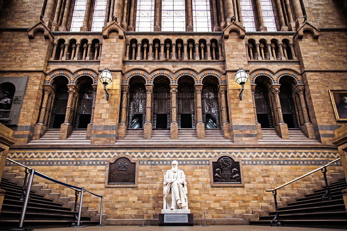 landscape photo of statue infront of brown building - visiting London for the first time