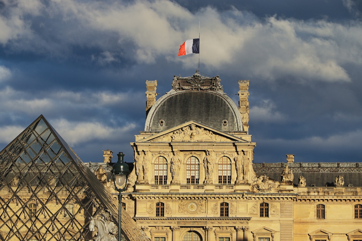 a large building with a flag on top of it - event in Paris