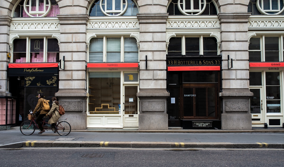 white and red concrete building - London Transportation