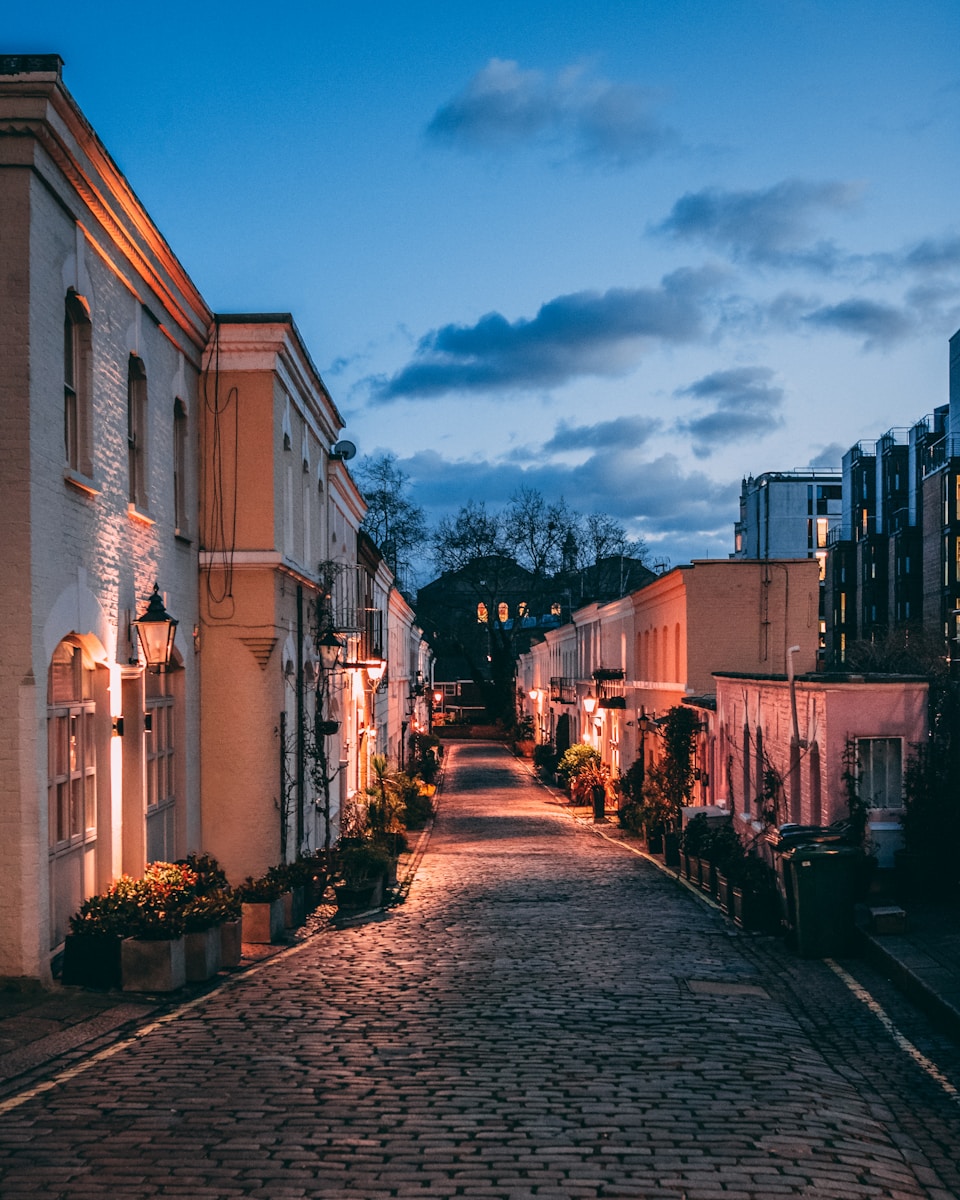 lighted buildings during dark cloudy twilight sky - where to stay in London