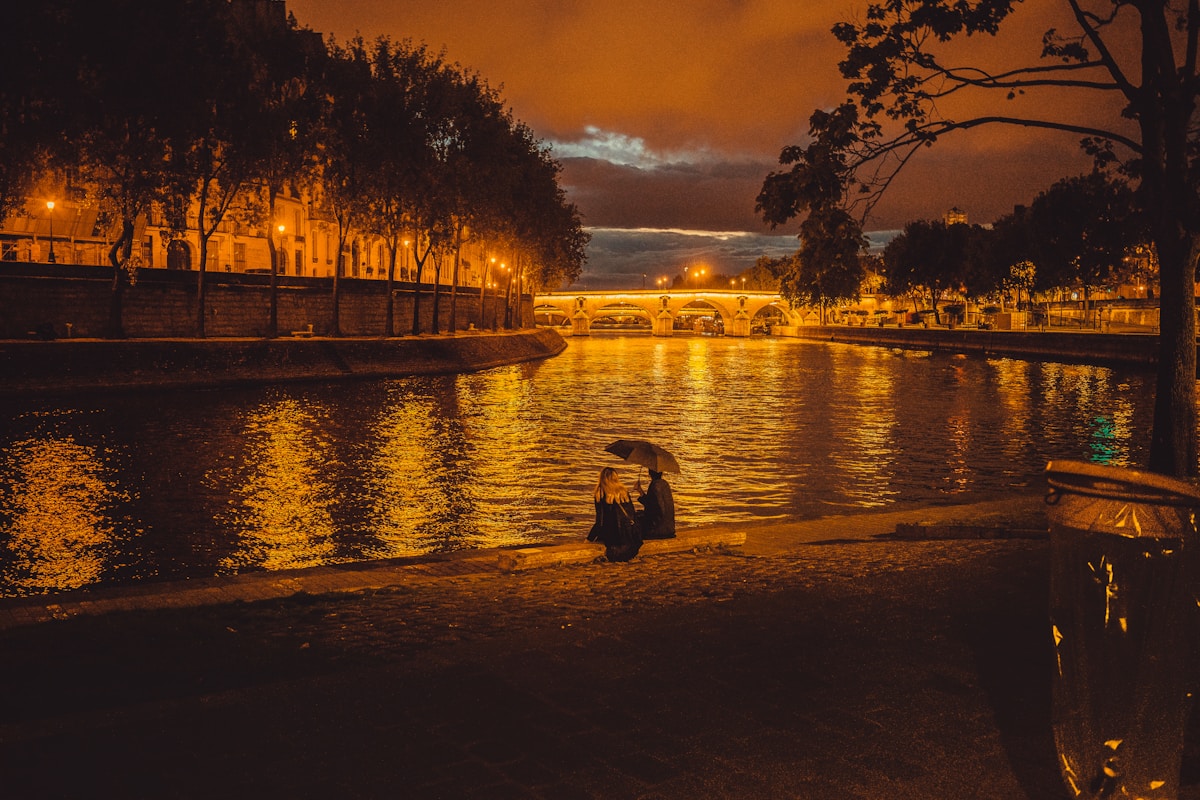 person sitting near pond - event in Paris