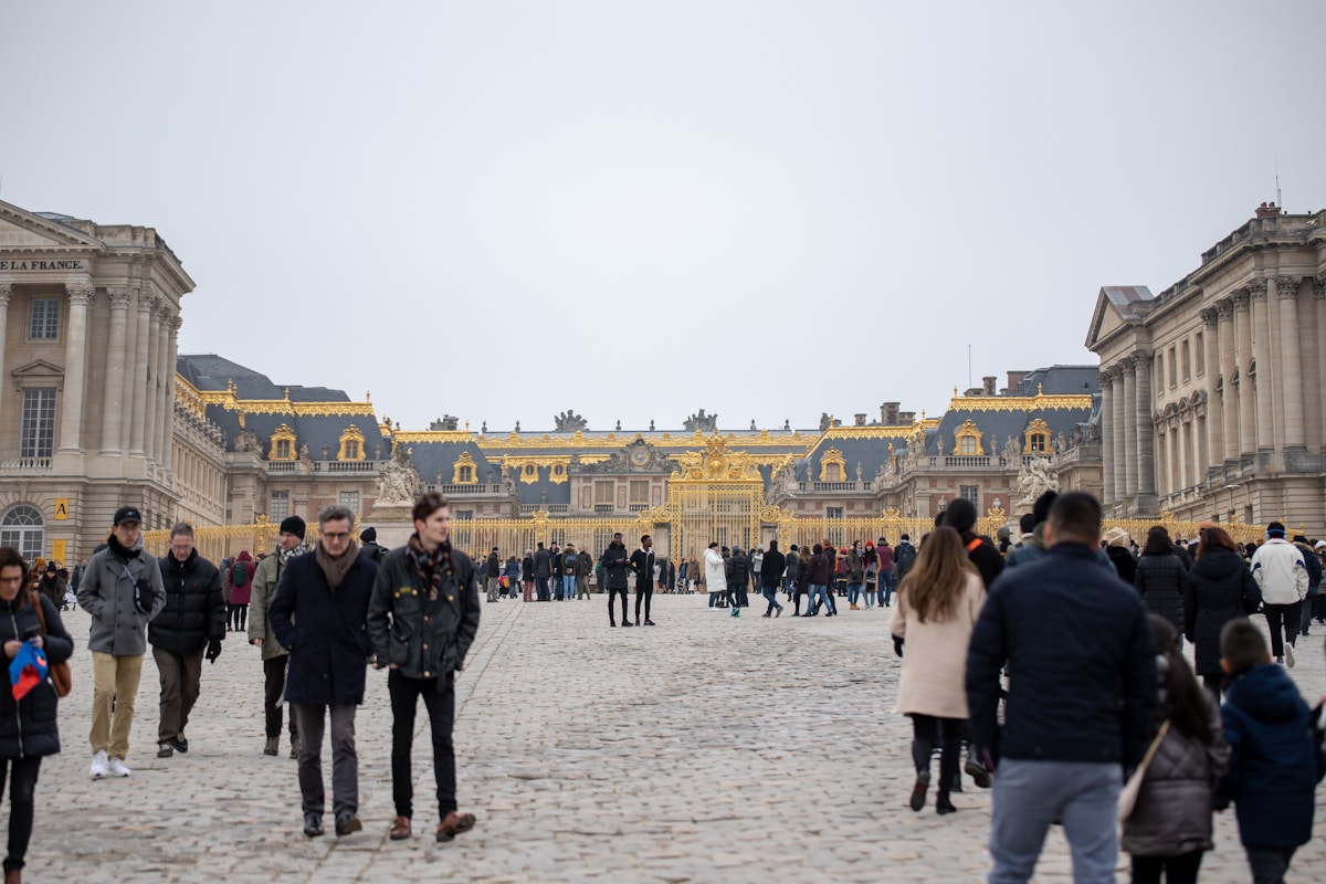 group of person walking on road - Palace of Versailles