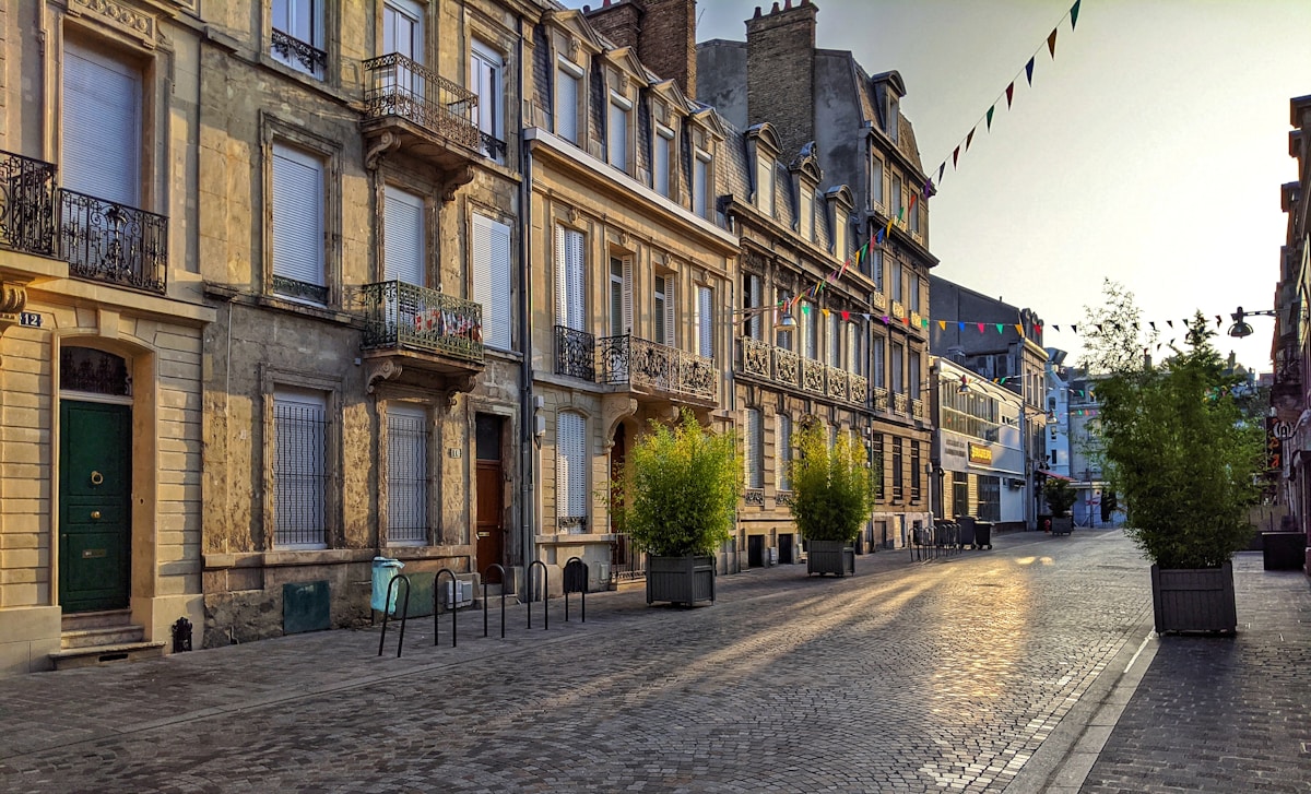 brown concrete building during daytime - City of Reims France