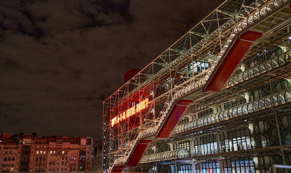 a building with a sign on it - Centre Pompidou Paris