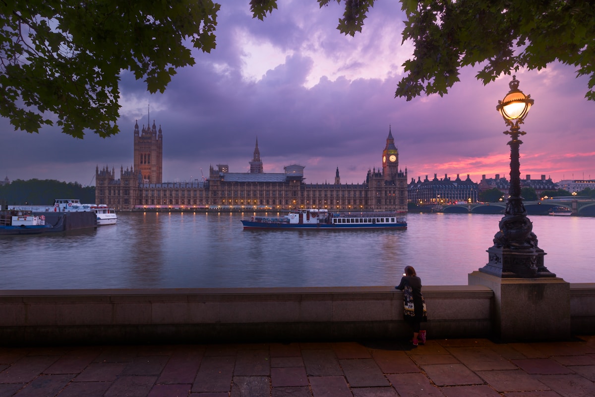 white concrete building near body of water during night time - Big Ben and The Parliament