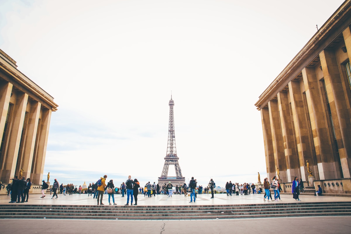 people standing while watching Eiffel tower - Backpacking Paris