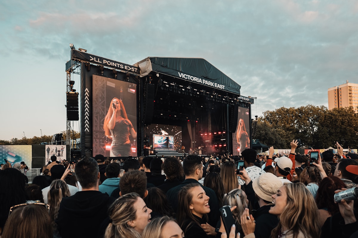 people gathering on concert during daytime - Festivals in London