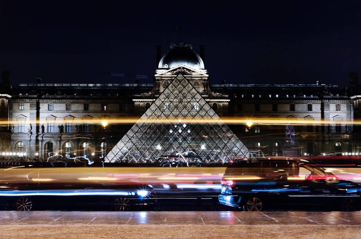 black vehicle near building - Pyramide, Le Grand Louvre Paris