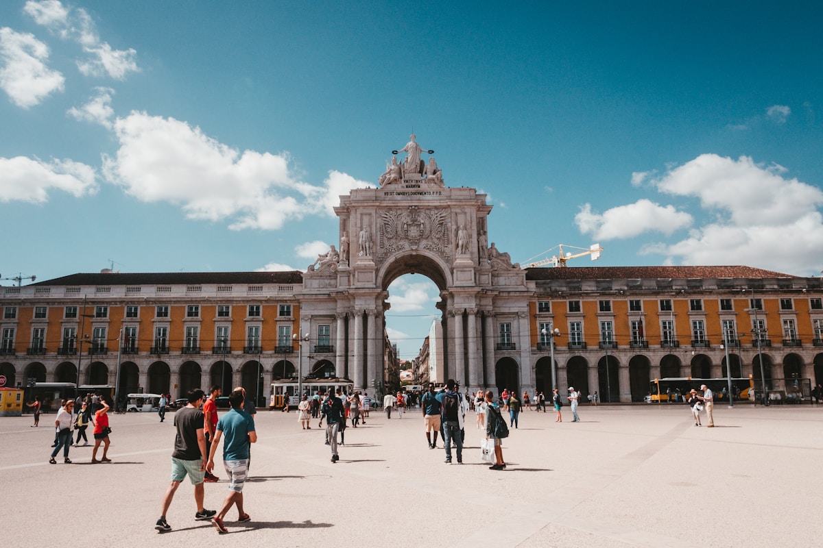 people gathered on street - Lisbon Portugal