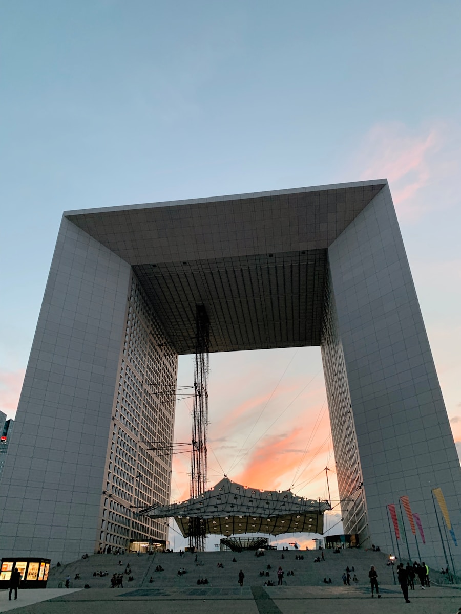 a very tall building with a massive entrance - La Grande Arche de la Défense