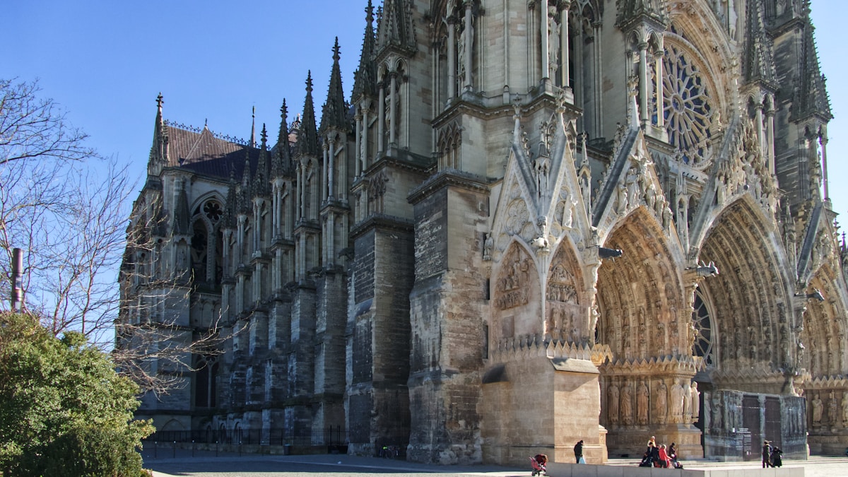 brown concrete cathedral during day - day trips from Paris