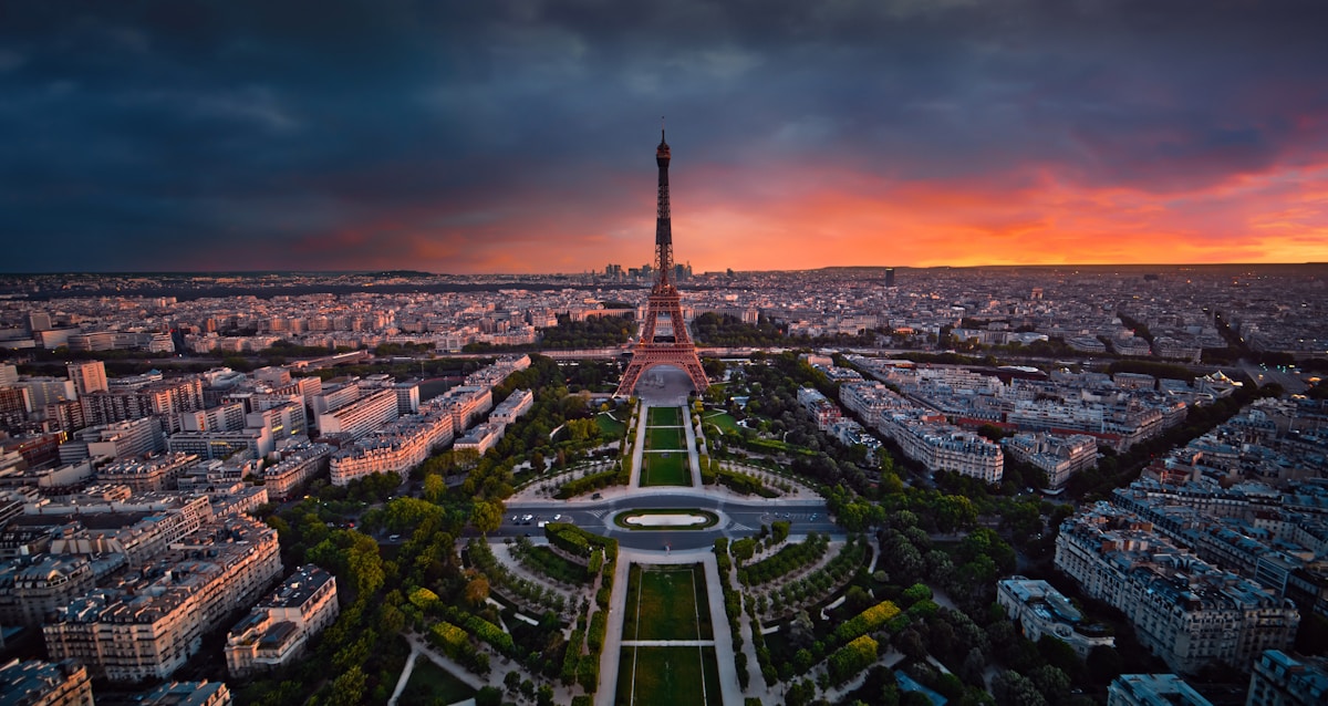 the eiffel tower towering over the city of paris - Champ de Mars, Allée Adrienne Lecouvreur, Paris, France