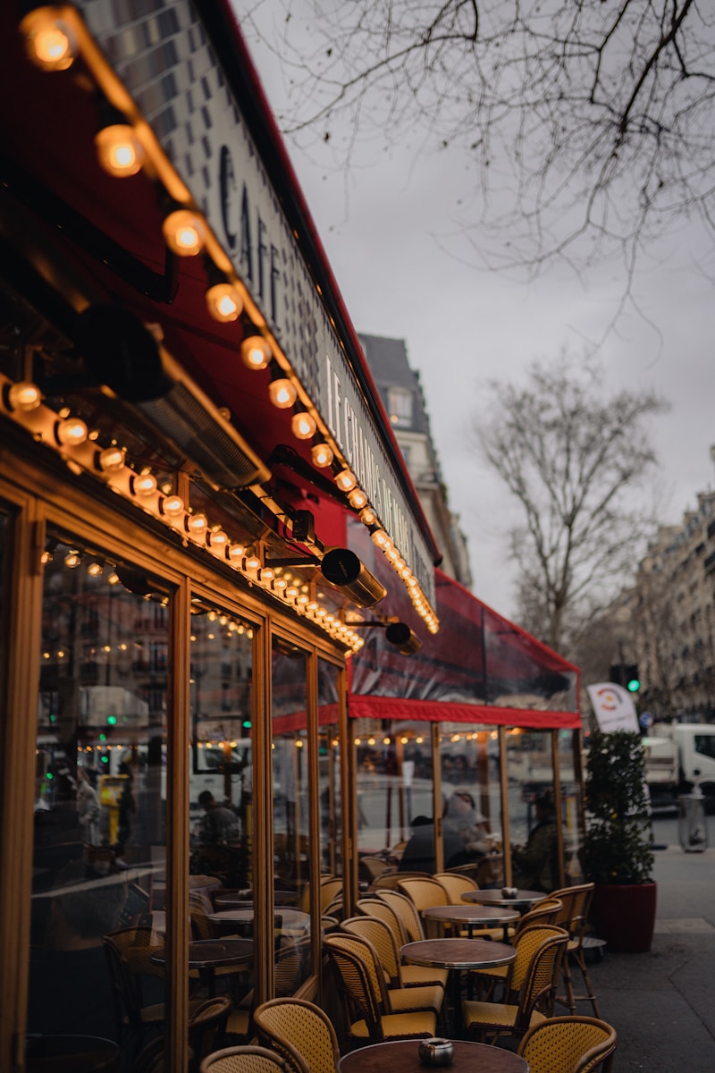 a row of tables and chairs outside of a restaurant - food and wine guide Paris