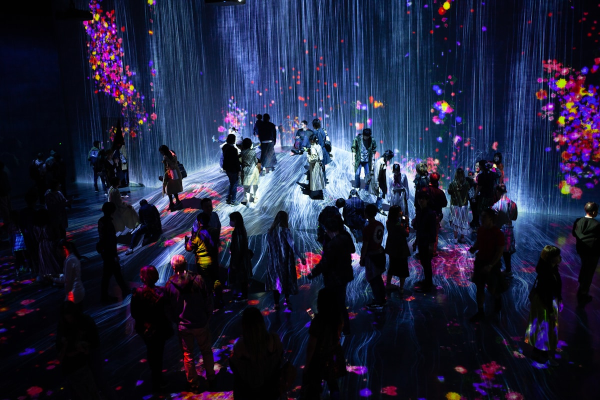 group of people inside room - TeamLab Planets Tokyo