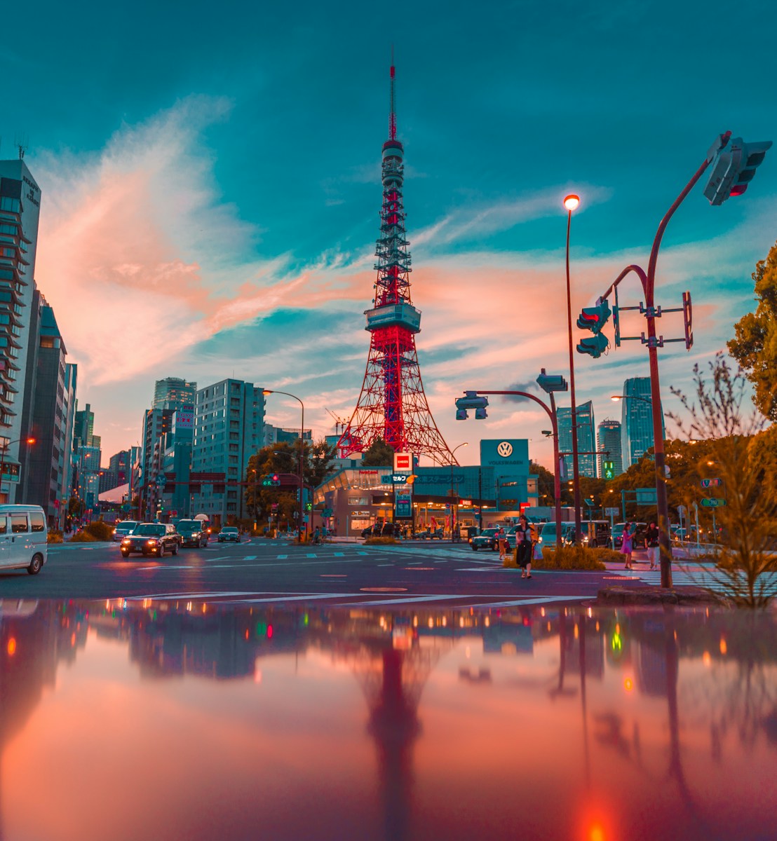 architectural photo of tower between buildings - Tokyo Tower, Minato-ku, Japan