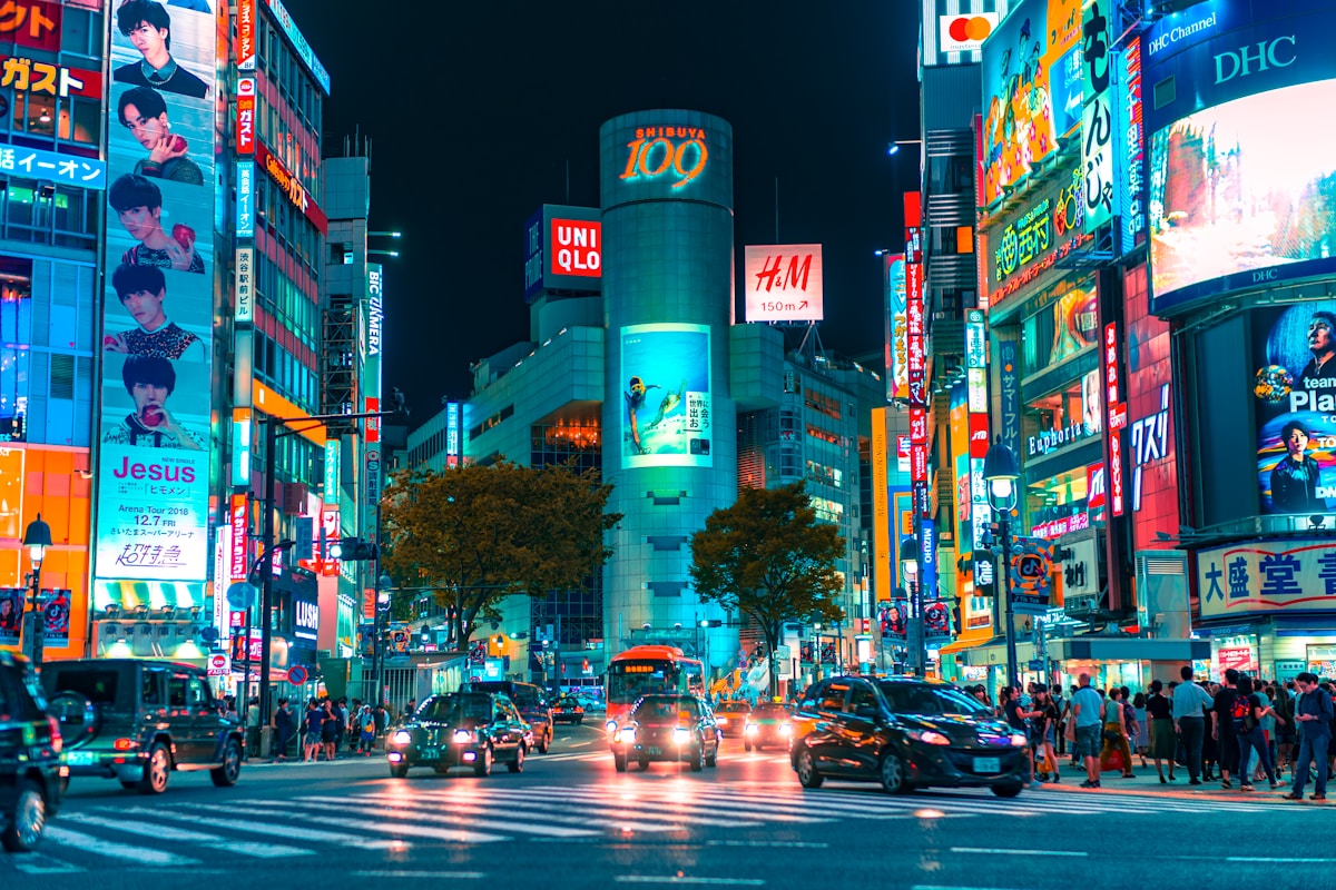 people gathered outside buildings and vehicles - Shibuya Crossing, Tokyo