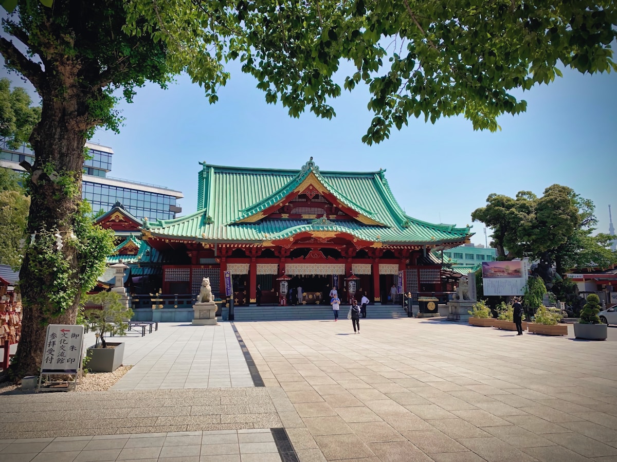 people walking outside temple - Kanda Matsuri