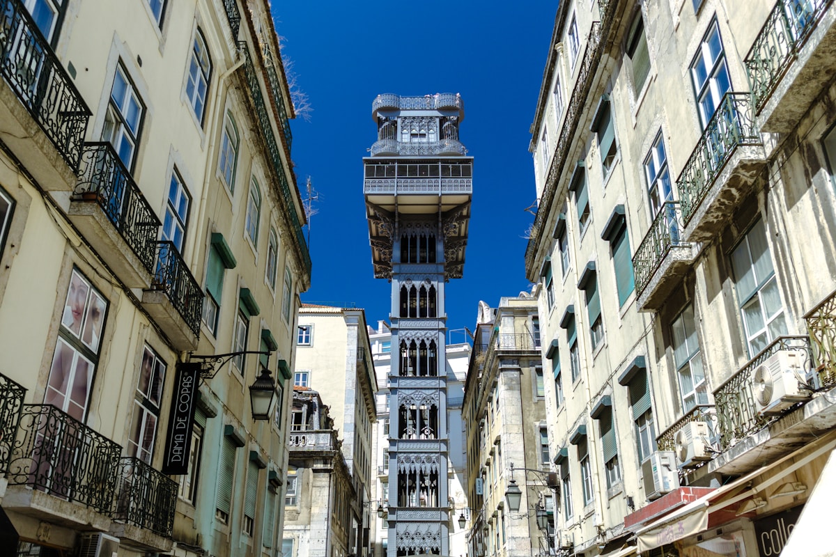 beige buildings - Santa Justa Elevator, Lisbon, Portugal