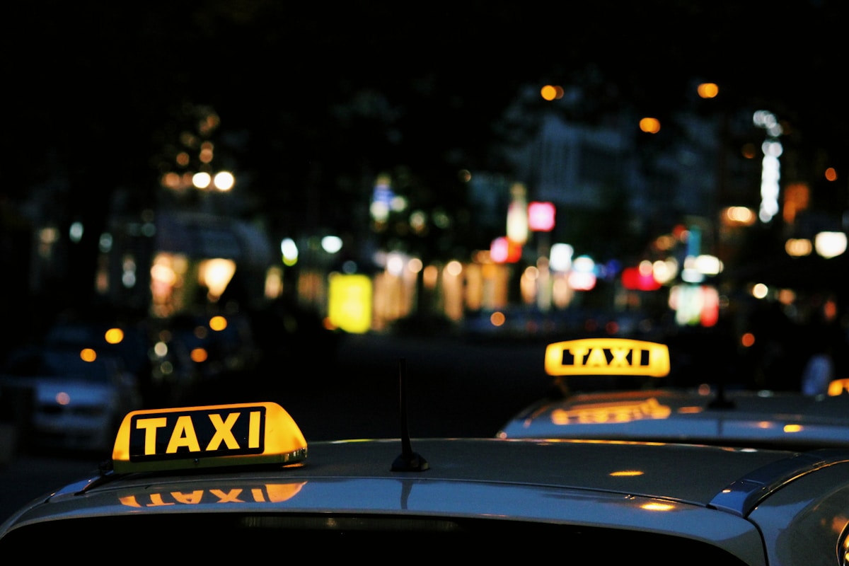 shallow focus photography of Taxi signage - Taxi in Lisbon