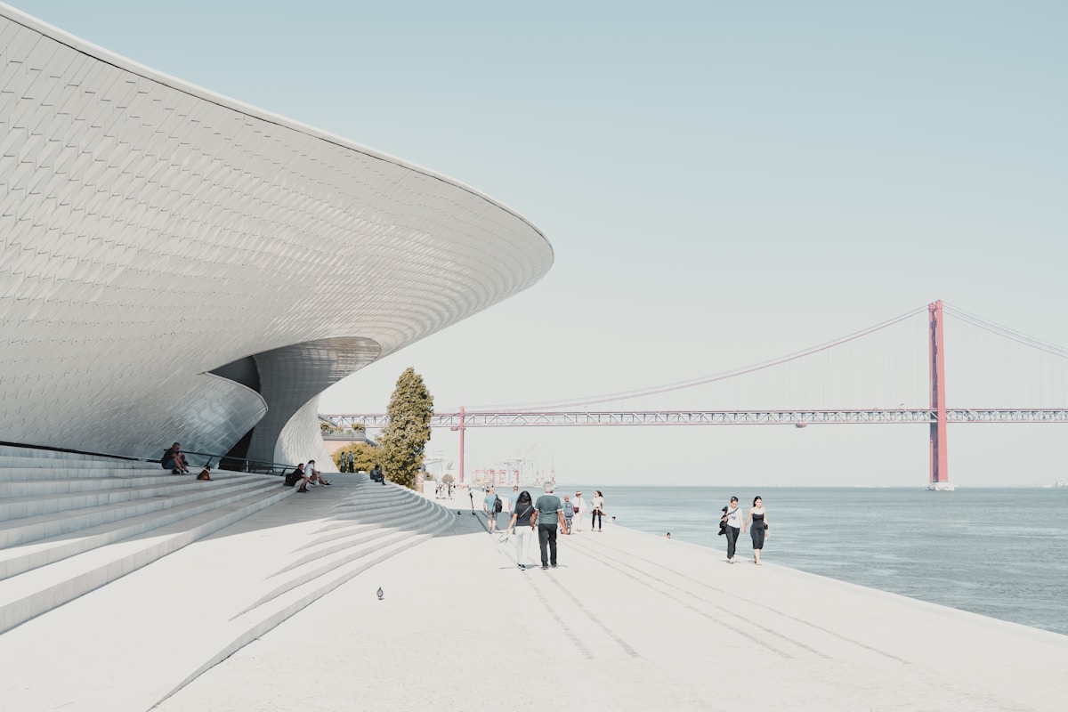 people walking on beach during daytime - MAAT, Lisbon, Portugal