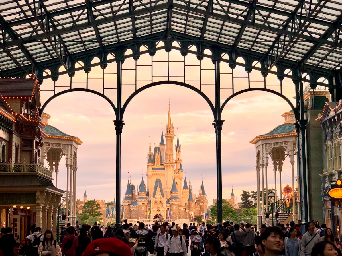 white and blue castle - Tokyo Disneyland