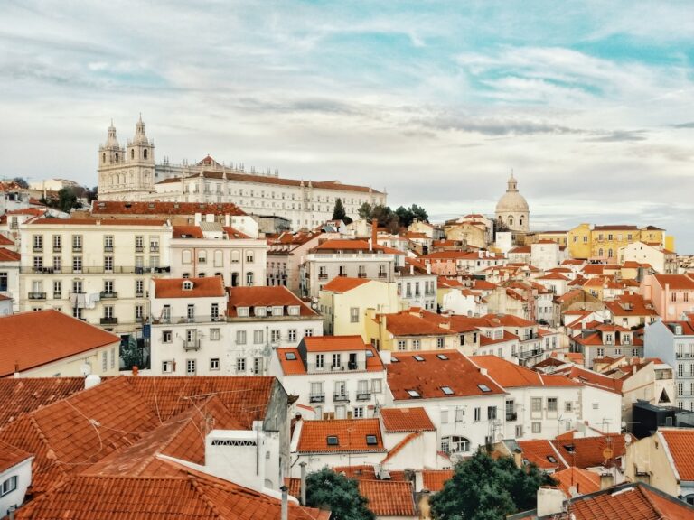 city landscape photography during daytime - Looking out over Alfama, Lisbon