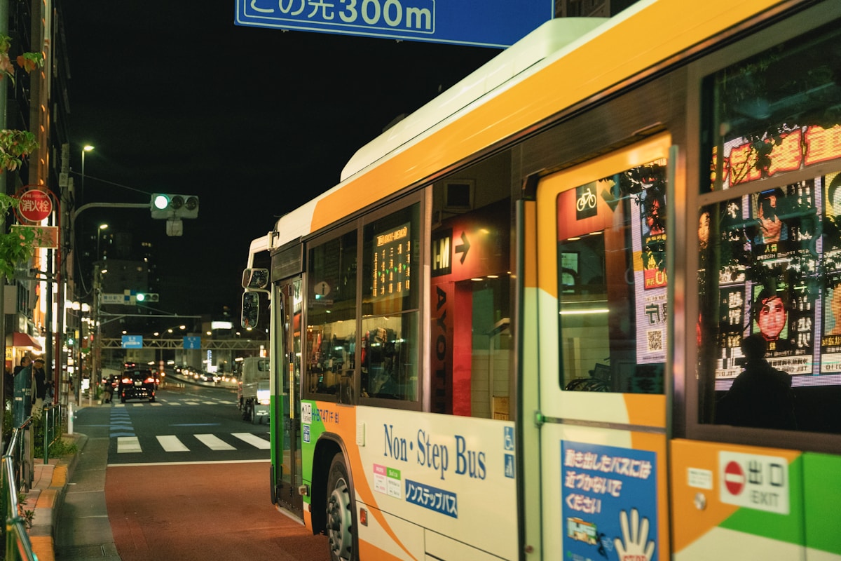 A bus is parked on the side of the street - Tokyo Bus