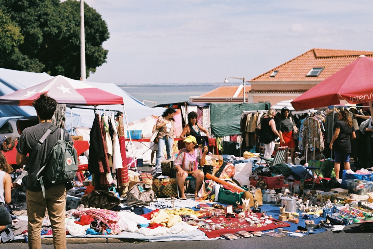 people at a market - Feira da Ladra Lisbon Portugal