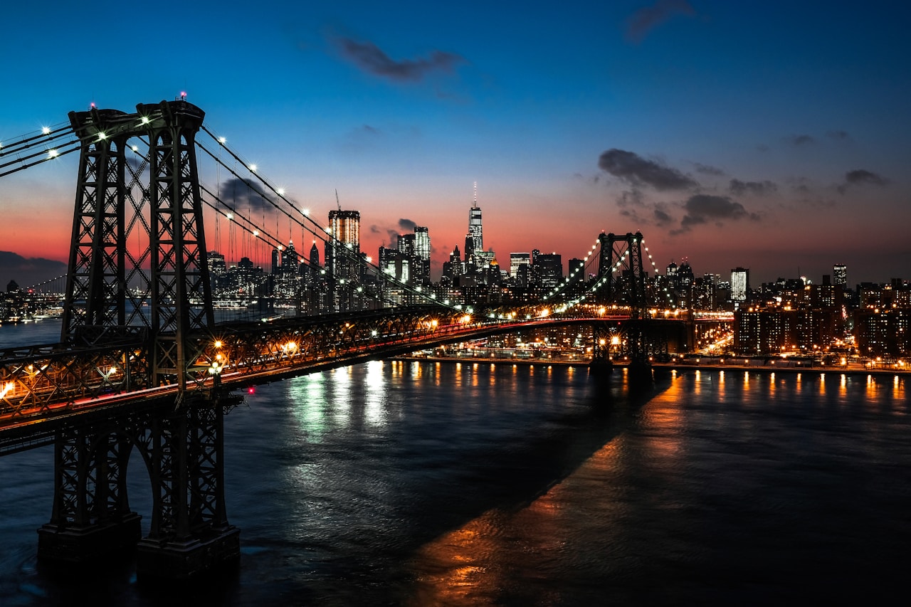 Things to Know Before Visiting New York City, lighted cable bridge near high-rise buildings