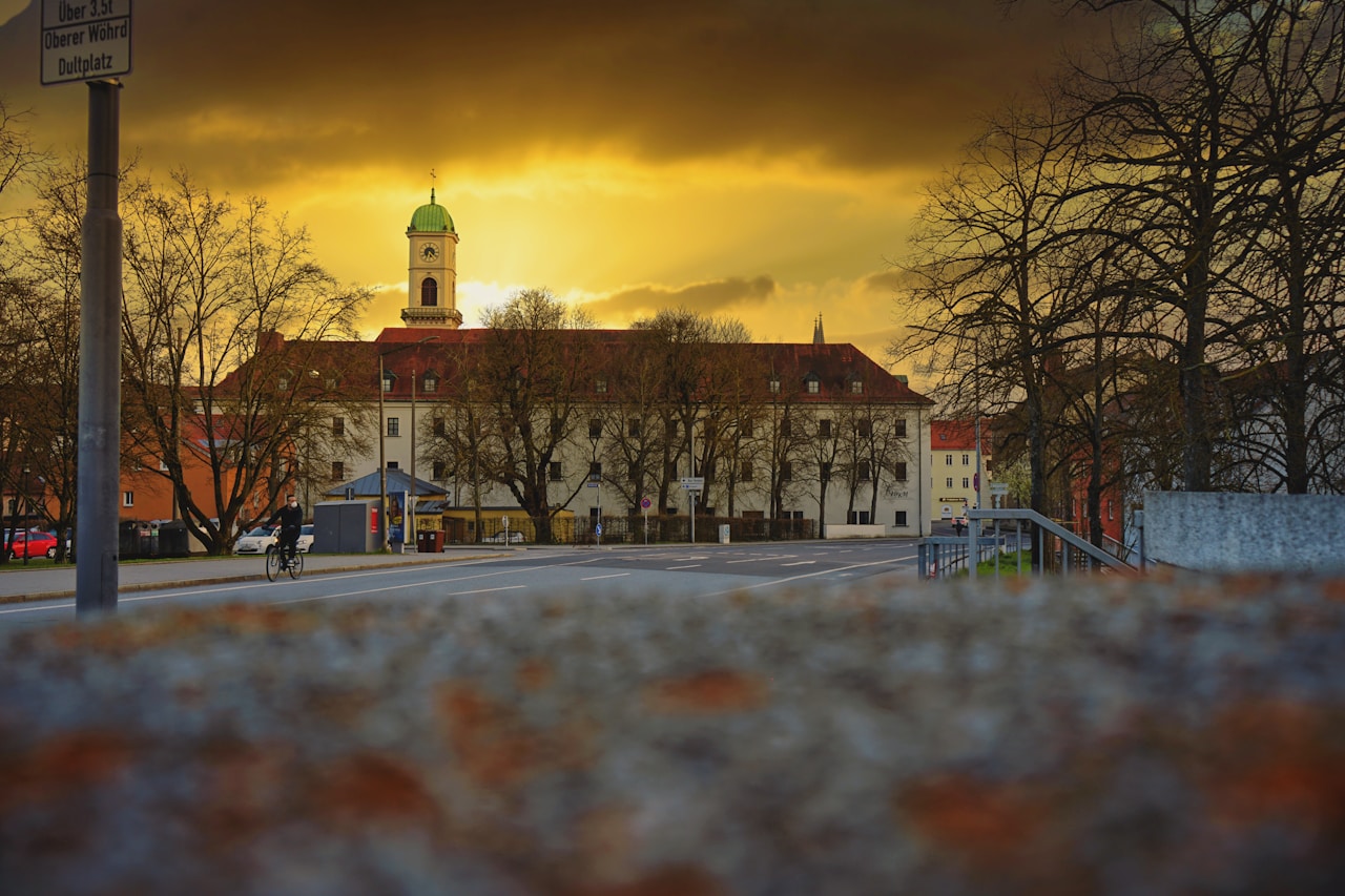 Best Day Trips From Munich, white and brown concrete building near bare trees during sunset