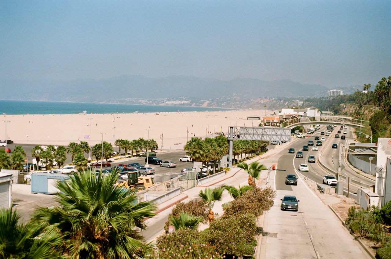 A beach and highway scene in california.