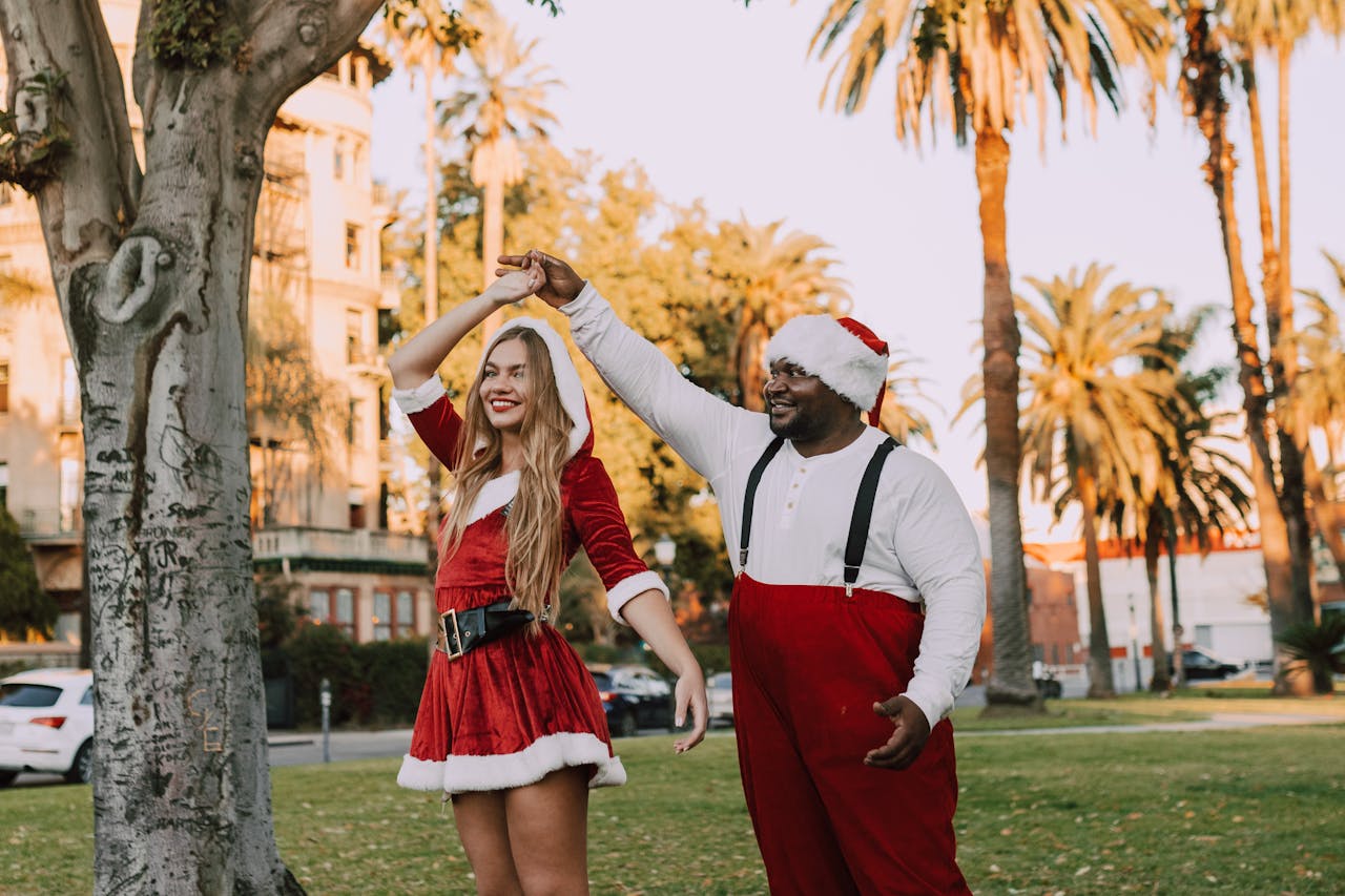 A joyful Santa and Mrs. Claus dance in a park, celebrating the holiday season with cheer and style.