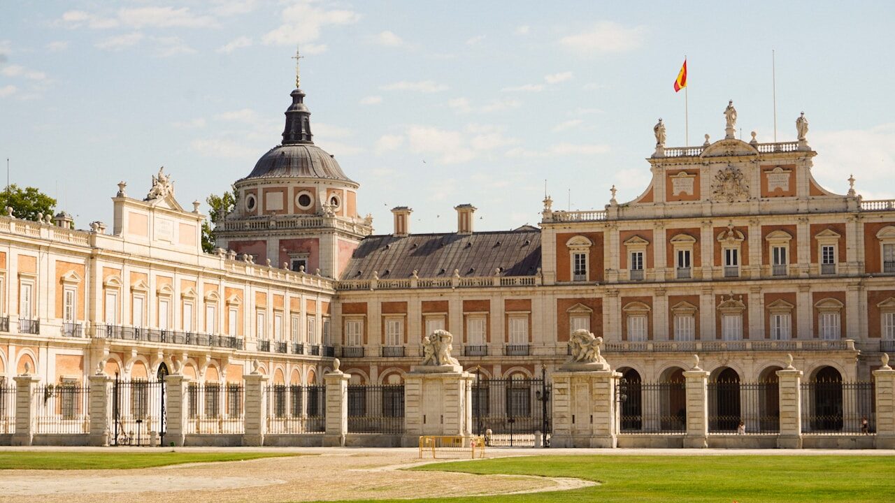 A large building with a large lawn in front of it