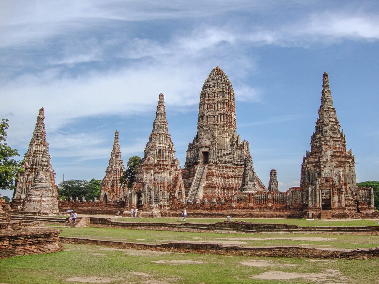 Historic Ayutthaya temple complex featuring ancient spires, showcasing Thailand’s rich cultural heritage and architectural beauty.